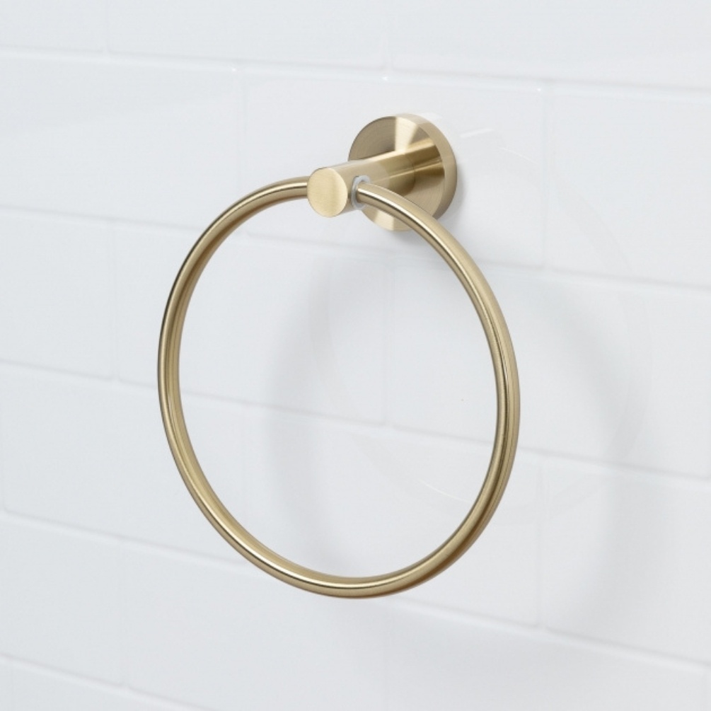 Lifestyle image of the Bristan Round Brushed Brass Towel Ring